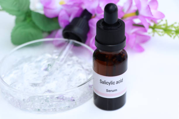 Salicylic Acid Serum Bottle with Flower Background